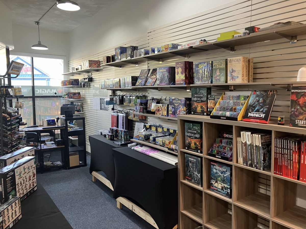 Shelves of tabletop games, roleplaying books, and hobby supplies at Mana Core