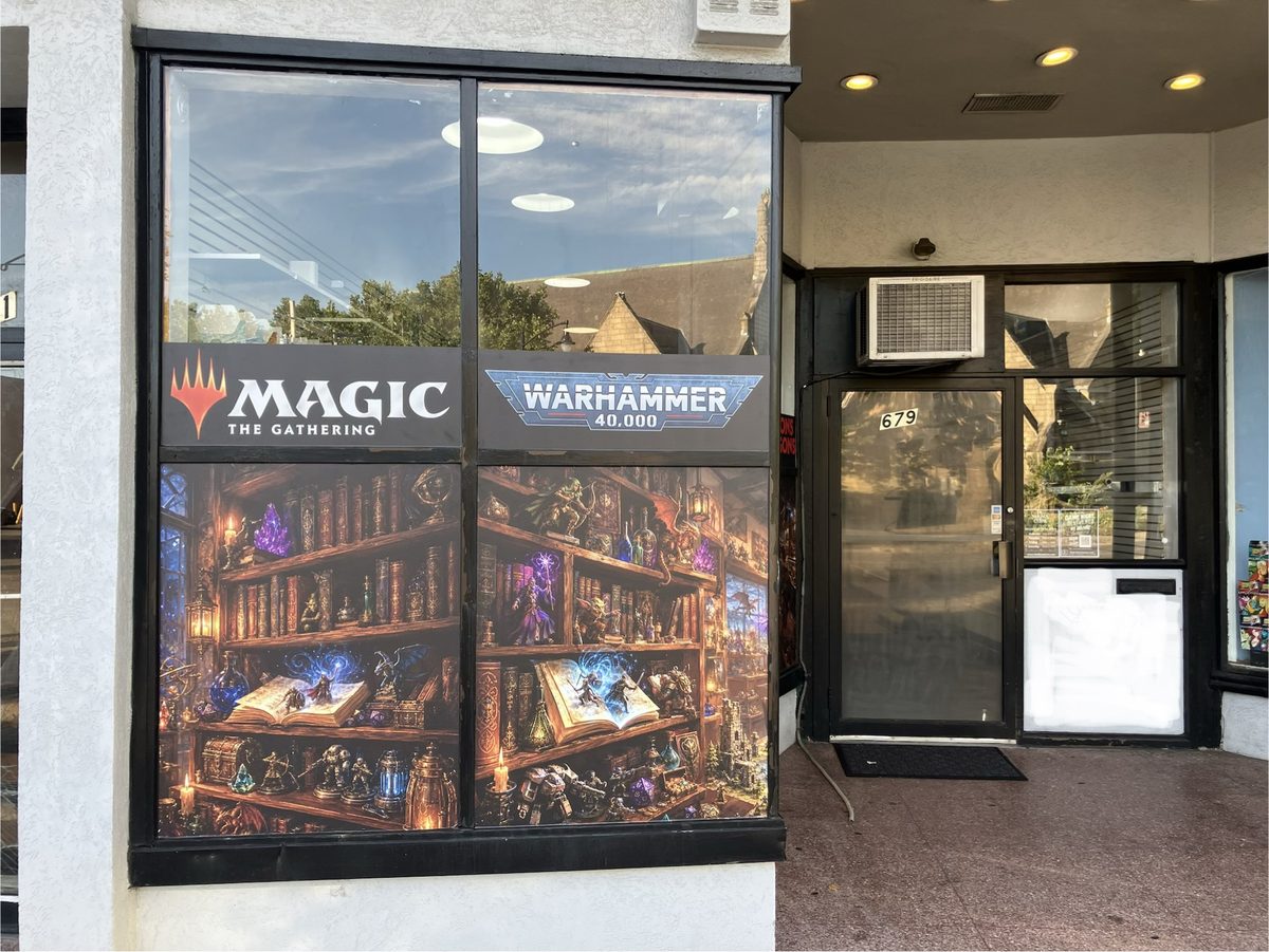 Mana Core’s storefront at 679 Broadway, with Magic and Warhammer window graphics